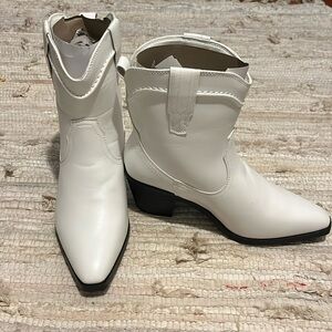 Brand new white cowboy boats